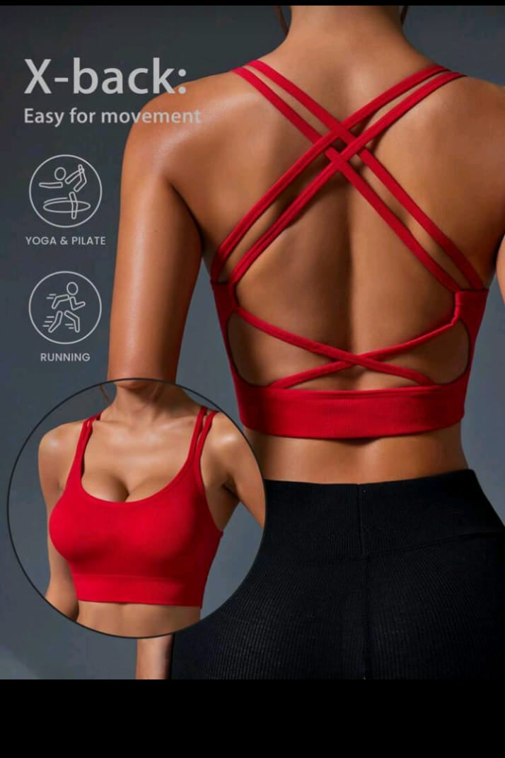 Red sports bra with criss-cross back design on a dark background